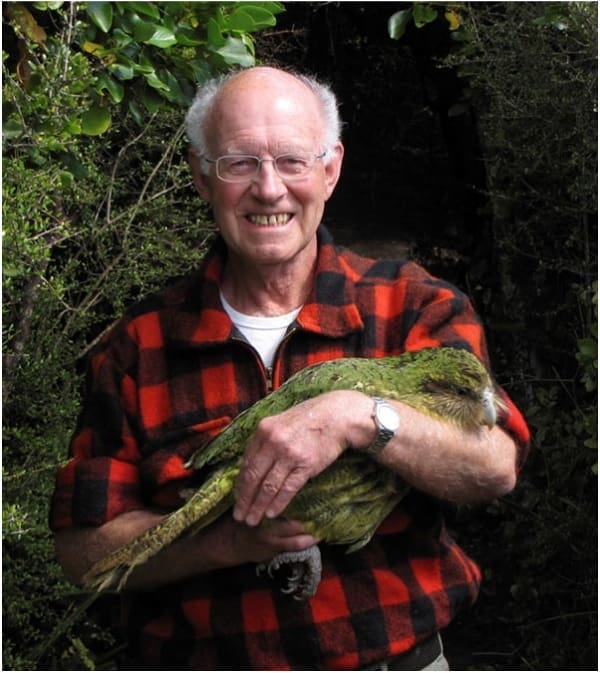 Don Merton, New Zealand conservationist, cradles Kākāpō Richard Henry